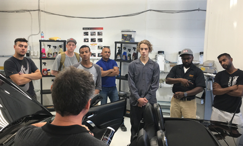 Detailer Danny Grenier of Auto-Chem teaching students how to maximize quality and efficiency in the detailing department.